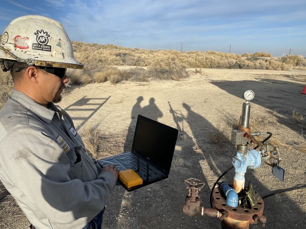 First Energy Service Crew Member conducts a survey